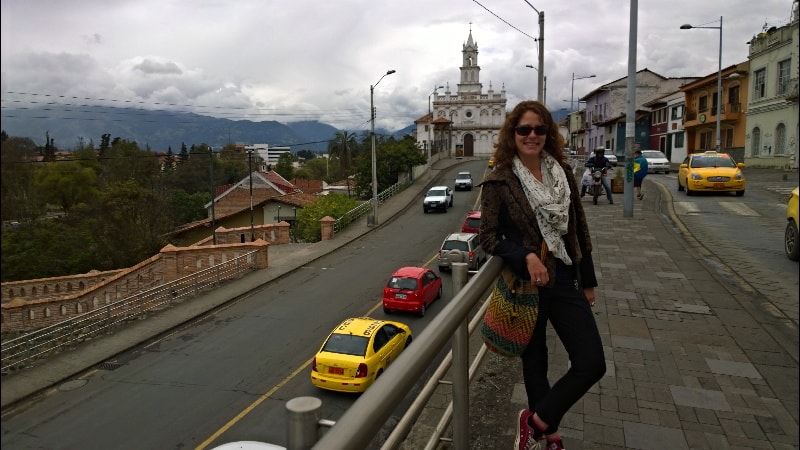 Nora with a church behind her